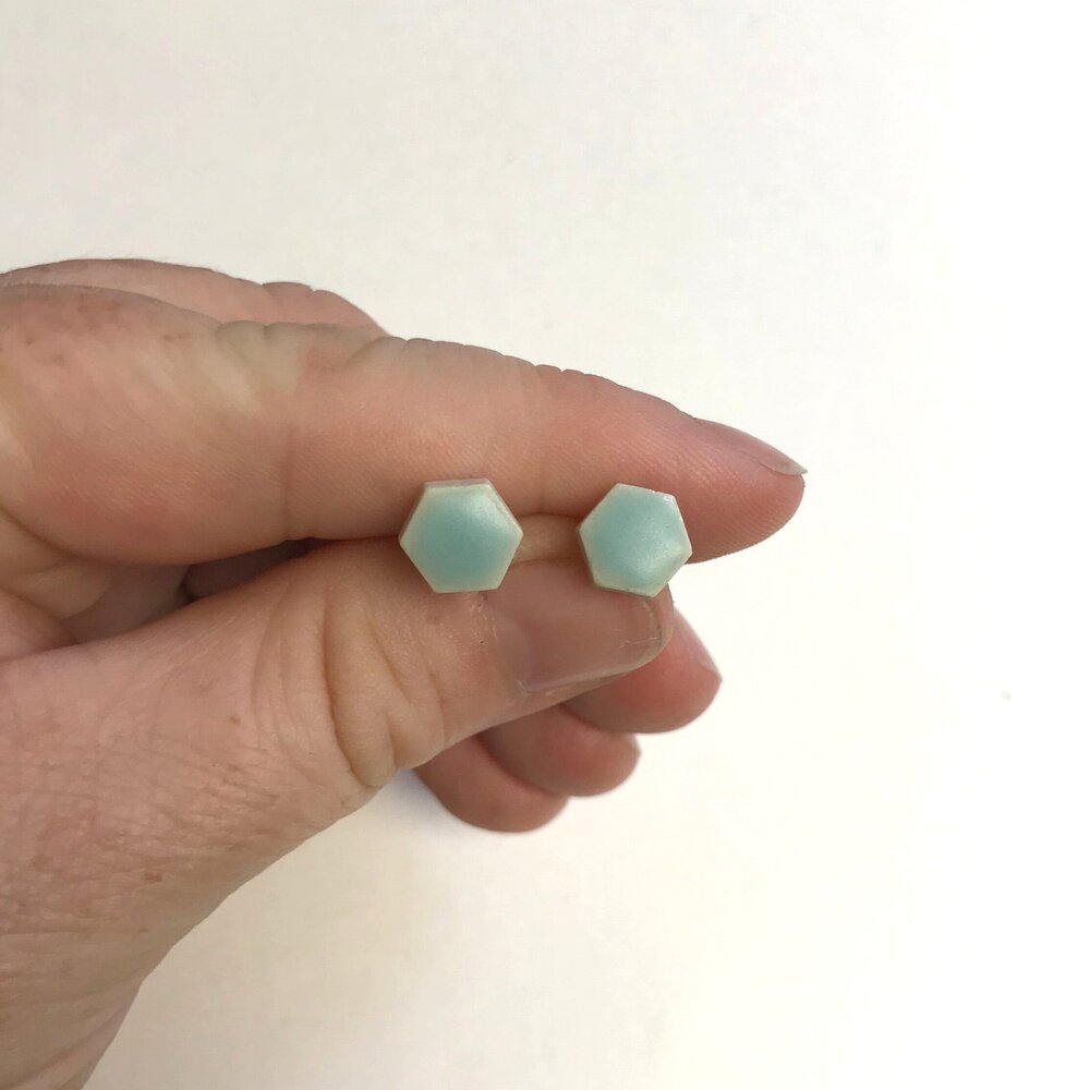 Hexgaon shaped ceramic stud earrings with seafoam glaze