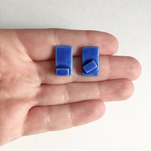 Load image into Gallery viewer, Handmade, 3 dimensional ceramic stud earrings. Rectangle earrings in blue jeans coloured glaze.
