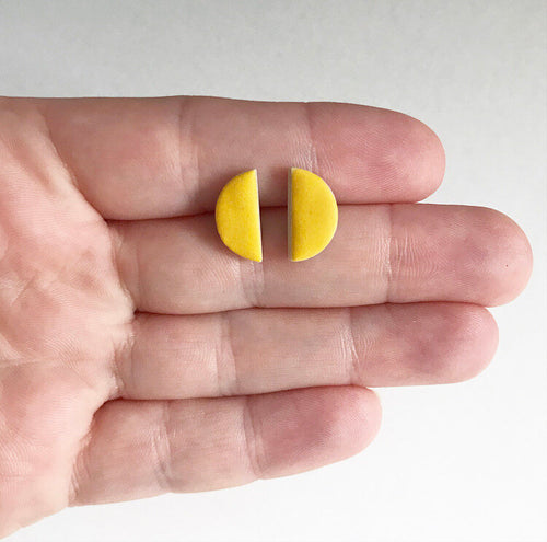 Semi circle ceramic stud earrings with yellow glaze