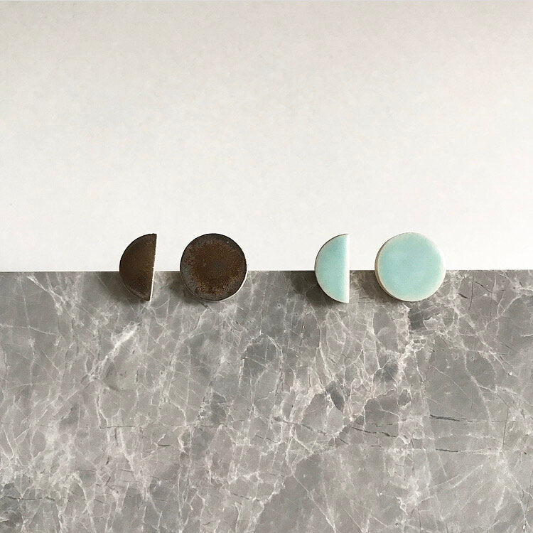 Semi circle shaped, ceramic stud earrings with seafoam or bronze glaze.