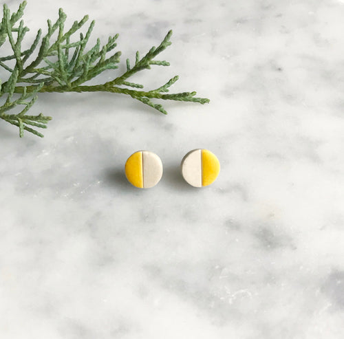 Circle ceramic stud earrings with yellow glaze